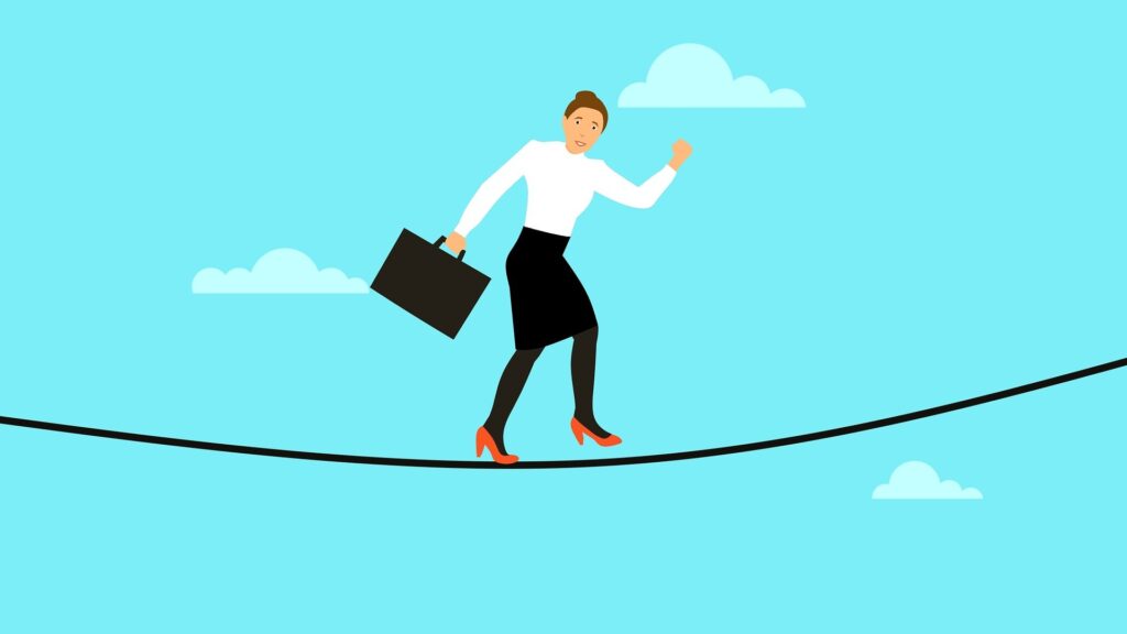 A woman carrying a briefcase walks on a tightrope.