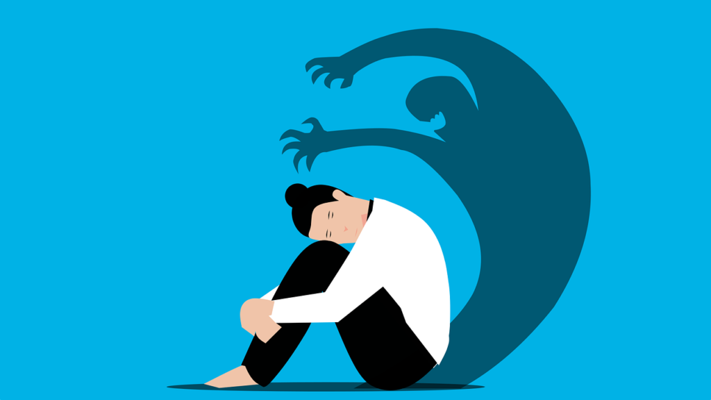 A woman crouched on the ground while her shadow looms over her like a monster.